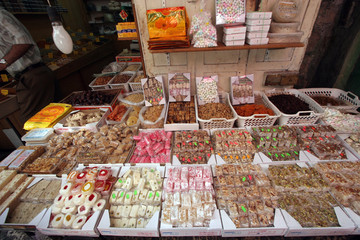 Candy shop in the souq of the Muslim Quarter in the Old City in Jerusalem, IL. Souqs are traditional middle eastern markets selling various foods and commodities.