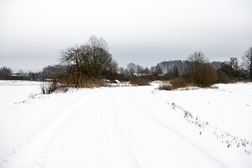 deep snow covered road in winter
