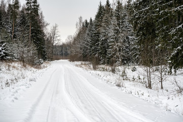 deep snow covered road in winter