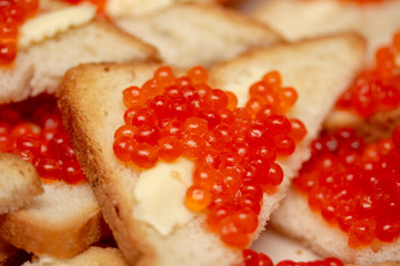 Tasty and bright sandwich with red caviar
