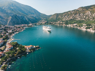 Fototapeta na wymiar summer time. aerial view of sea bay with boats and cruise liner