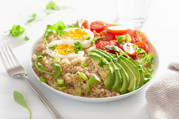 quinoa with boiled egg, avocado, tomato, arugula. healthy breakfast