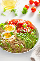quinoa with boiled egg, avocado, tomato, arugula. healthy breakfast