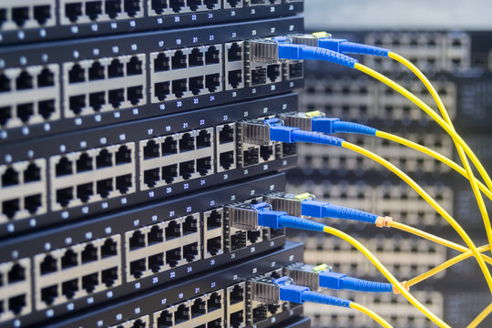  Fiber-optic cables are connected to the switch ports. High-speed data transfer. Server communication equipment of the Internet provider.