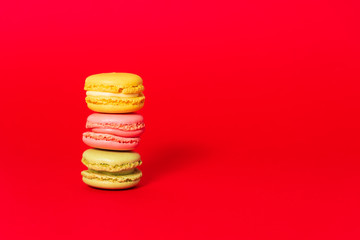 Macarons on red background