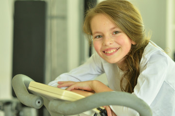 Portrait of cute little girl doing exercises