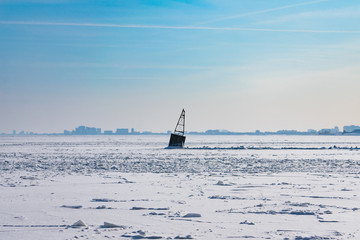 A Buoy in a Frozen Lake Michigan in Chicago after a Polar Vortex