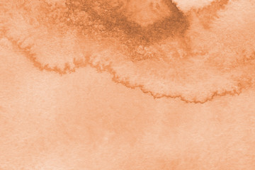 Orange watercolor texture with abstract washes and brush strokes on the white paper background.