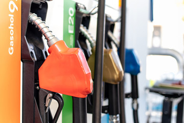 Fuel oil dispenser in petrol filling station. Fuel nozzle at a gas station.