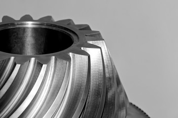 Industrial conical gear, cogwheel. Black and white toned image.