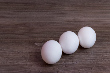Three white eggs in a row