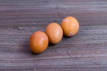 Three brown eggs close up