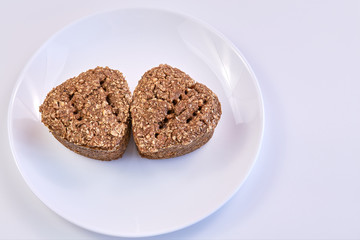 wheat germ bread and rye on a white round plate. healthy food. homebaked bread.
