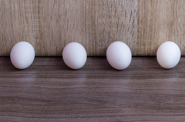 Four white eggs in one row