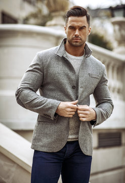 Portrait of handsome man in gray stylish jacket