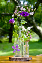 Wedding flower arrangement series. Bouquet of flowers for a wedding event in clear bottles