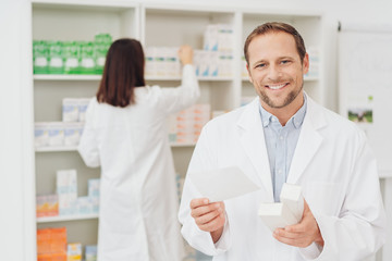 Friendly attractive male pharmacist