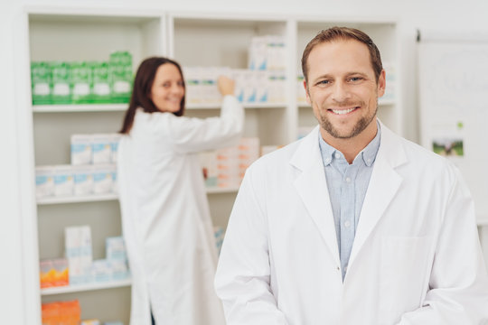 Attractive male pharmacist with a friendly smile