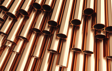Set of copper pipes lying in one heap.