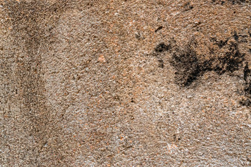 Sandstone texture with dark spot close up