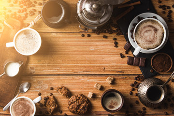 Black coffee with milk flatlay view on wooden background