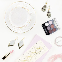 Feminine flat lay with women fashion accessories, lingerie, jewelry, cosmetics, coffee and flowers. Top view