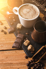 Black coffee with milk flatlay view on wooden background
