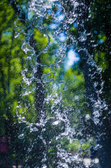 transparent falling water vertical flows, close up