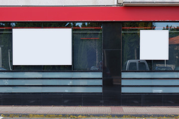 Two blank billboards in a bank office