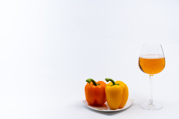 Alcoholic drinks such as wine or beer and variable colorful side dish such as vegetables or fruites surrounded clean white wall for the celebration of anniversary day.