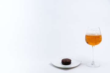 Alcoholic drinks such as wine or beer and variable colorful side dish such as vegetables or fruites surrounded clean white wall for the celebration of anniversary day.