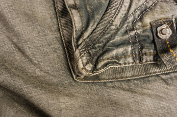 clothing items washed cotton fabric texture with seams, clasps, buttons and rivets