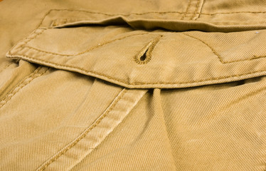 clothing items washed cotton fabric texture with seams, clasps, buttons and rivets