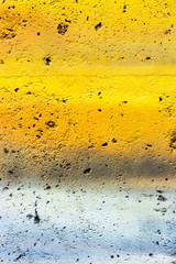 Bright colorful background. Painted concrete in different pastel colors. Bright and fresh palette of halftones.