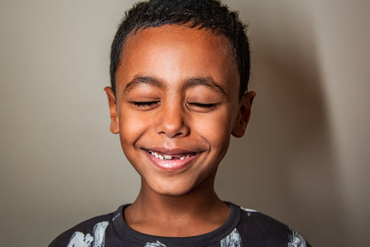 Happy African American boy smiling in a studio