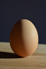 brown egg on wooden table