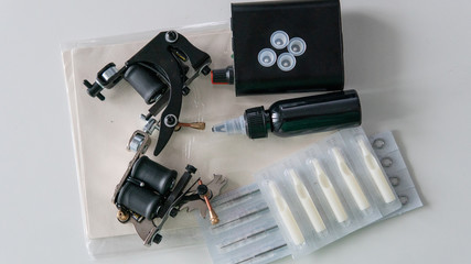 Accessories for tattooing on the skin. Tattoo machines close-up