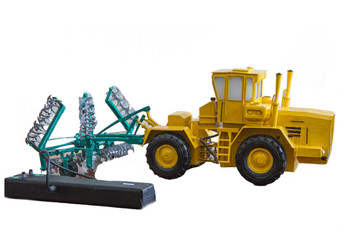 Obraz na płótnie Canvas Tractor model with a cultivator