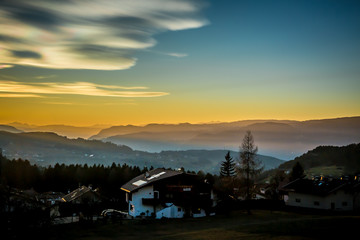 Fototapeta na wymiar Beautiful colorful sunset sky over the mountains in South Tyrol