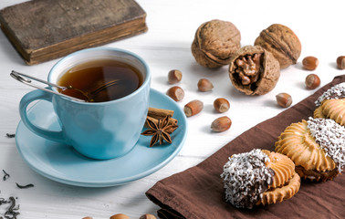 Obraz na płótnie Canvas Tea with cookies on wooden background