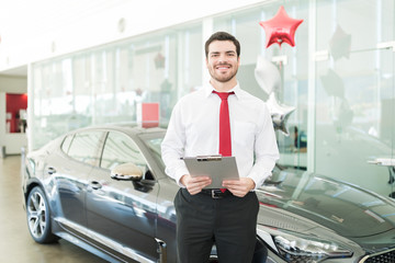Confident Salesman Ready To Sell New Car