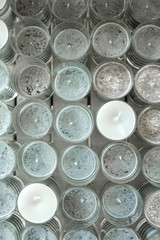 Lot of grey decorative candles in glass for event decoration