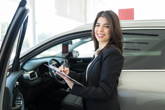 Woman Working At Car Dealership