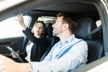 Showing Interior Details Of Luxury Car To Customer