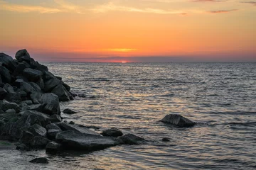 Fotobehang sunset on the beach © Алена Кожемякина