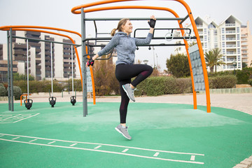 Cheerful jogger exercising outside