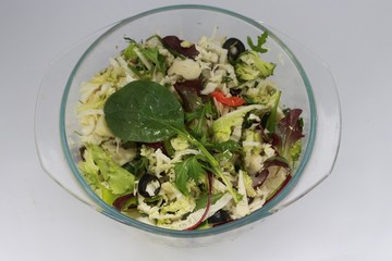 salad of ñabbage  broccoli and spinach in the glass bowl