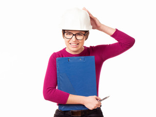 Emotional girl brigadier in a white helmet with glasses and a folder in his hands on a white background