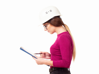 Emotional girl brigadier in a white helmet with glasses and a folder in his hands on a white background