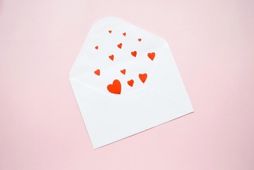 An envelope with hearts
